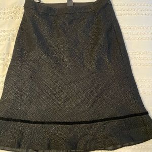 Beautiful black skirt. Fitted with bottom ruffle. Wool and acrylic.